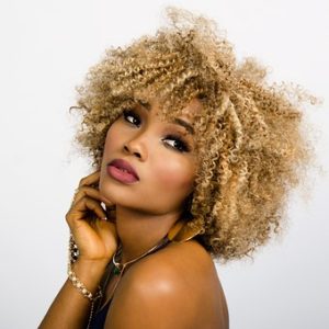 a lady with curly golden hair